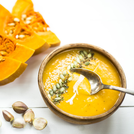traditional autumn dish for Thanksgiving - pumpkin soup with garlicの写真素材