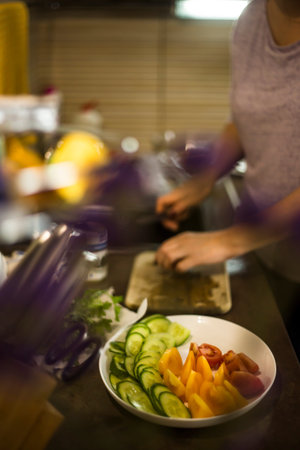 Preparation of a vegetable plate for a family dinner in a home kitchen