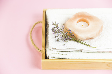 wooden tray with accessories for spa procedures with a floppy, candles and soapの写真素材
