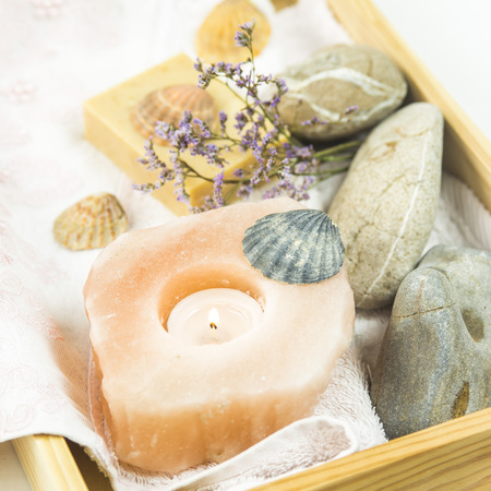 wooden tray with accessories for spa procedures with a floppy, candles and soapの写真素材