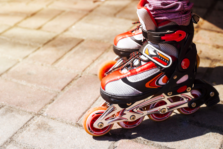 Children's red rollers for outdoor activities on spring and summer days. Close upの写真素材