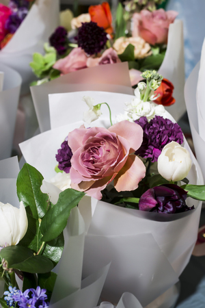 Delicate modern bouquet with a rose on the flower marketの写真素材