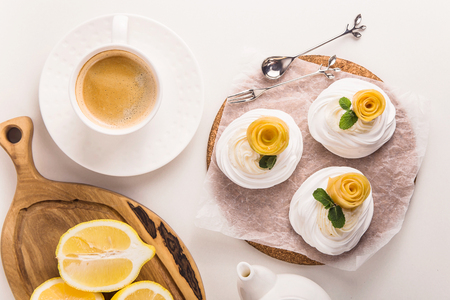 Light festive pavlova dessert made from meringue, lemon kurt and whipped creamの写真素材