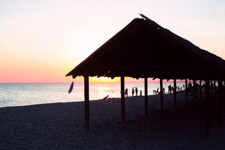 Old canopy to create shade on the beach by the sea in Crimea. Summer landscape backgroundの写真素材