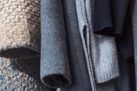 Texture of autumn women clothes sweaters and coats. Baclground, close up texture
