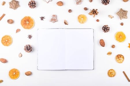 A white notebook among eco zero waste Christmas accessories for a festive decor. Top view, flat lay.の写真素材