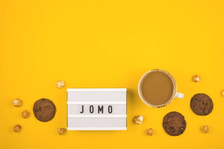 The concept of joy of missing out on bright yellow background.の写真素材