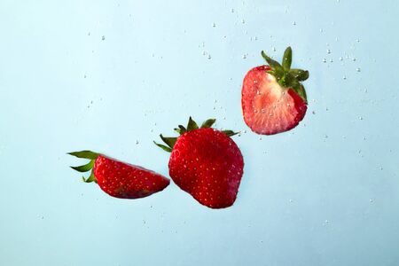 Red strawberry with bulbs in clear water.の写真素材