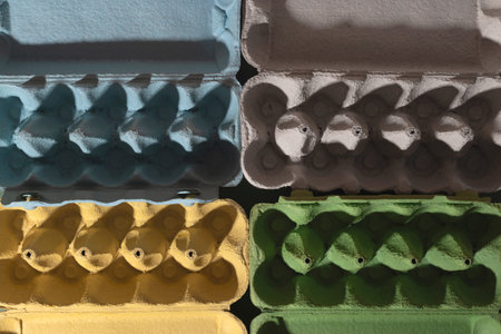 Colored trays from eggs. Garbage collection for recycling concept.