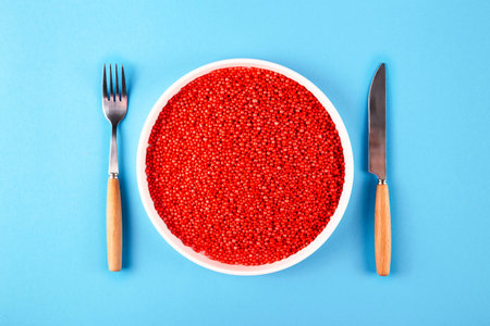 Plastic in a plate - harmful substances in food concept