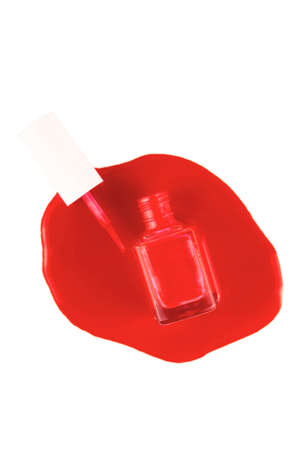 Red nail polish - open bottle with spilled nail polish and brushの写真素材