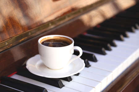 Coffee and piano on the summer terrace of the restaurantの写真素材