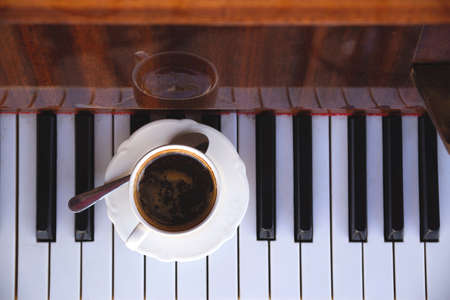 Coffee and piano on the summer terrace of the restaurantの写真素材