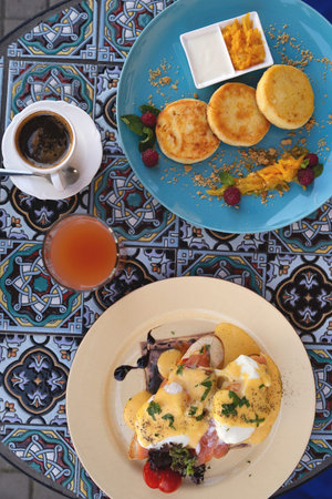 Beautiful healthy breakfast in a restaurant for two next to the piano