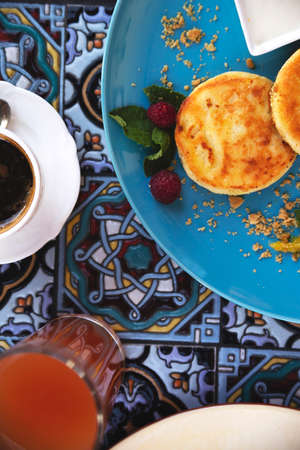 Cheese pancakes in a restaurant with a beautiful presentationの写真素材