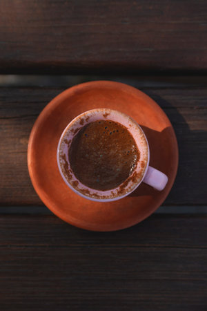 Turkish coffee on a wooden table in clay cup