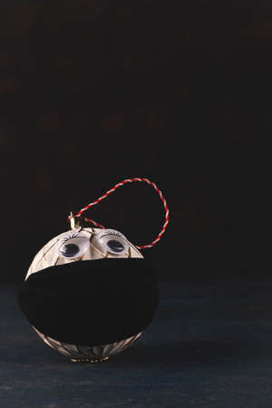 Christmas tree ball in a protective mask from the virusの写真素材