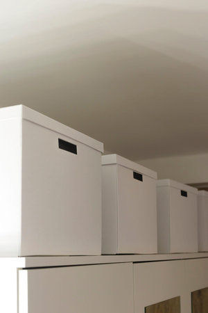 White cardboard boxes as a storage element in the interior