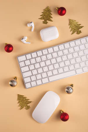 Minimalistic Stylish computer workplace among Christmas decorationsの写真素材