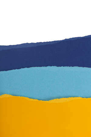 Layers of multicolored torn textured paper as creative backgroundの写真素材
