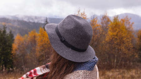 Wanderlust concept. Woman in boho style in the mountainsの写真素材