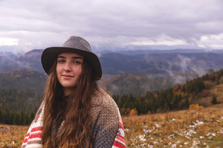 Wanderlust concept. Woman in boho style in the mountains