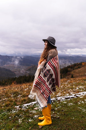 Wanderlust concept. Woman in boho style in the mountains