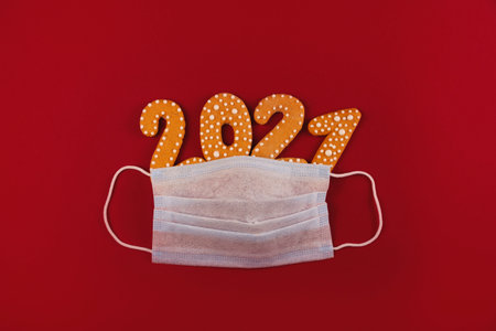 Protective mask with festive sparkles and stars on red backgroundの写真素材