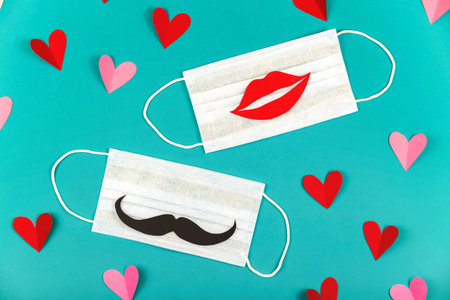 Layout in valentines day concept with masks. New normal