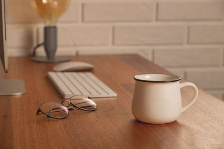 Home office - workplace at a wooden table in a cozy homeの写真素材