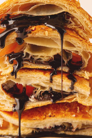 Texture of crispy puff croissants with liquid flowing chocolate.の写真素材