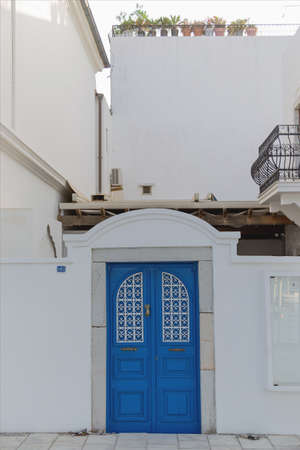 Beautiful blue door in a white wall in the style of European resorts. Bodurm, Turkey.の写真素材