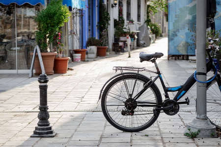 Bicycle in sunlight on the narrow tourist street of Bodrum, Turkey.の写真素材