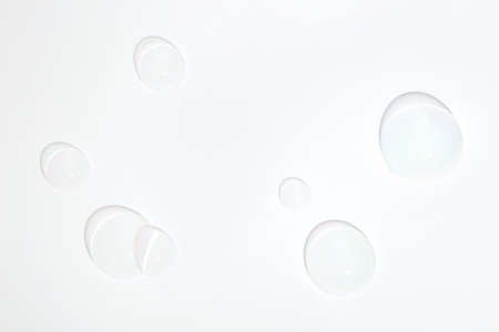 A hemisphere of a transparent soap bubbles on white background. Mockup for the presentation of cosmetics.の写真素材