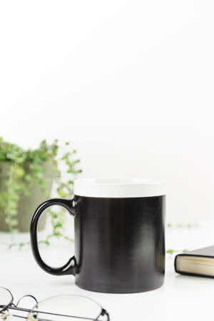 Black dad coffee mug mockup on workplace. Cup mock up for male style designの写真素材