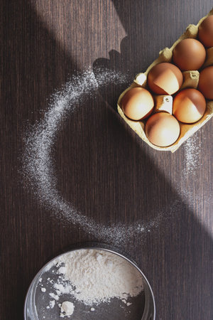 Eggs, flour and mixer in home kitchen for making pies and desserts for family.