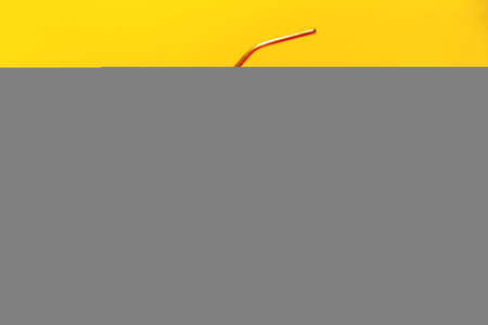 Big burger with french fries and sauce on bright orange and yellow background. American Fast food cuisine.の写真素材