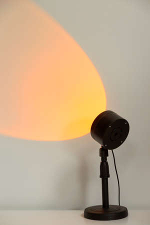 Electric sunset lamp for atmospheric, warm yellow illumination at home.の写真素材