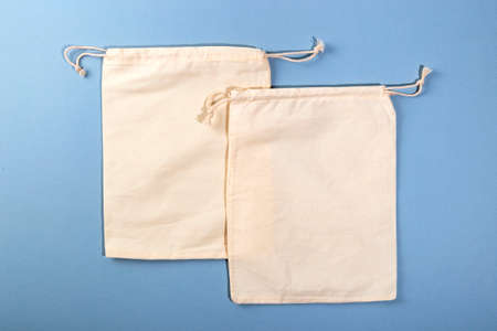 Two reusable Eco bag mock up for zero waste shopping on blue background. Minimal flat lay.の写真素材