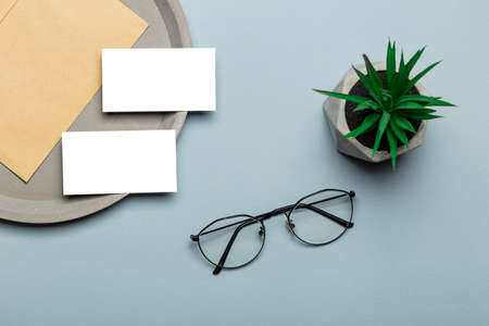 White thermo cup mock up on modern stylish workplase with laptop. Cup mockup.の写真素材
