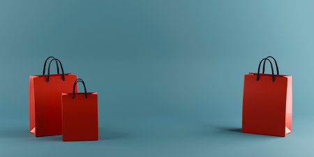 Red shopping bags on blue background. copyspace. 3d renderingの写真素材