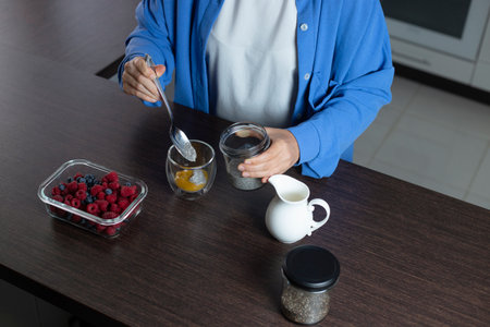 Healthy vegan dessert - chia pudding with mango and berries. Home cooking.の写真素材