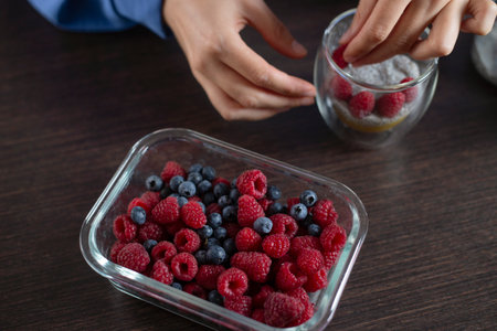 Cooking chia pudding with raspberries. Homemade healthy dessert.の写真素材