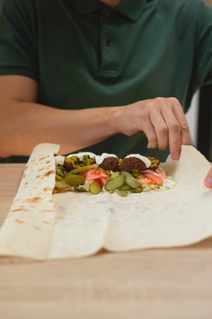 Man cooking homemade falafel meal.の写真素材
