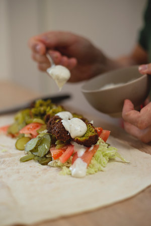 Man cooking homemade falafel meal.の写真素材