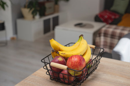 Fruit basket for healthy snack: bananas and apples.の写真素材