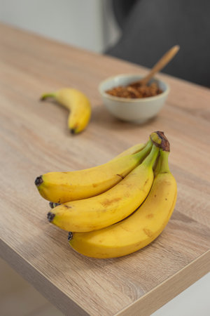 Organic bananas on table at home kitchen.の写真素材