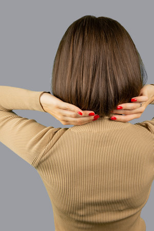 Woman with square hairstyle. Back to camera. Faceless.の写真素材