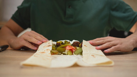 Man cooking homemade falafel meal.の写真素材