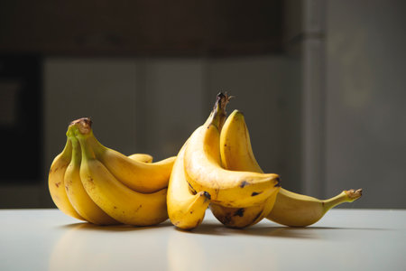 Organic bananas on table at home kitchen.の写真素材
